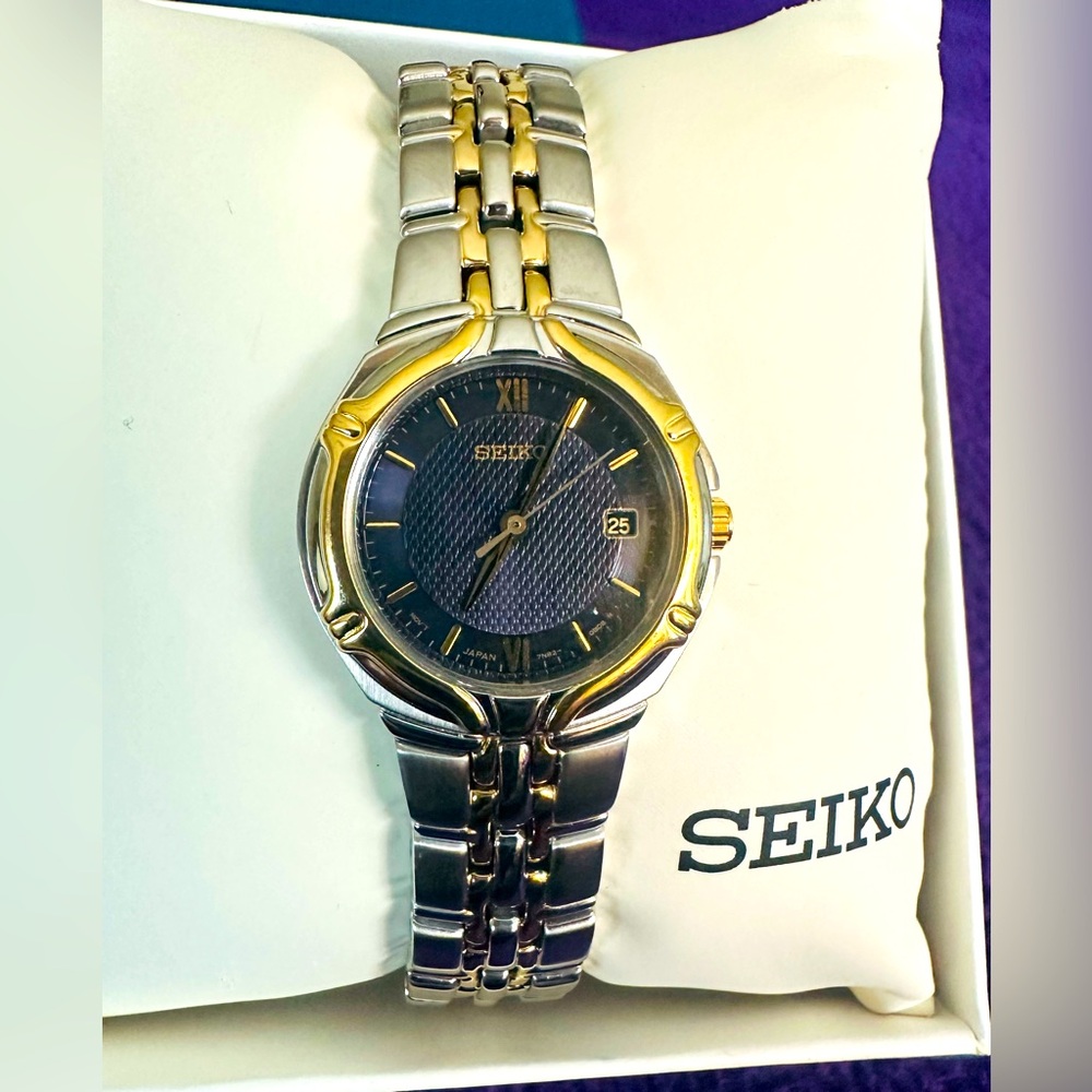 Ladies Seiko bracelet watch silver and gold tone, never worn and comes with box